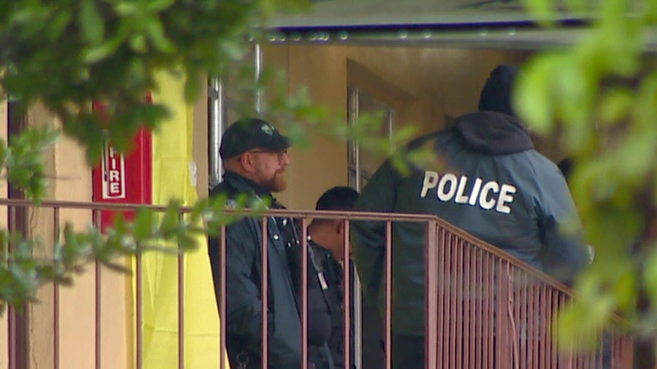 A crime scene tarp covers the front door of the apartment where a 3-year-old girl was stabbed to death by her mother, North Miami Beach police said.