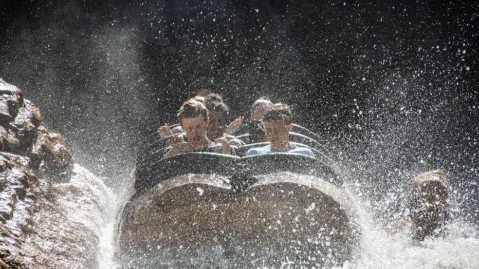 Guest react to being hit with cool water on Splash Mountain at the Magic Kingdom Park at Walt Disney World