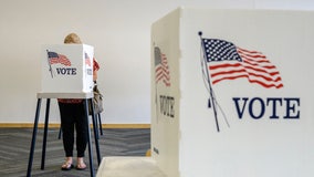 Iowa official's wife charged with 52 counts of voter fraud