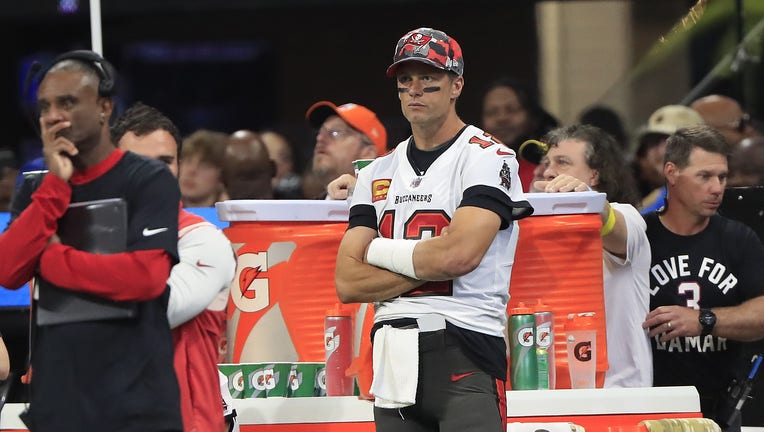 Tampa Bay Buccaneers quarterback Tom Brady (12) watches from the bench area during the second half of the Sunday afternoon NFL game between the Tampa Bay Buccaneers and the Atlanta Falcons on January 8, 2023 at the Mercedes-Benz Stadium in Atlanta, Georgia.