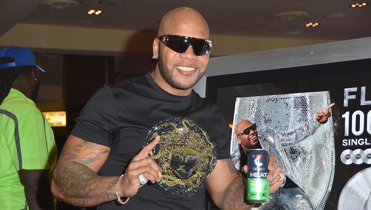 Rapper Flo Rida holds a can of Celsius Heat fitness drink during his memorabilia case dedication at the Hard Rock Hotel &amp; Casino on June 29, 2018 in Las Vegas, Nevada.