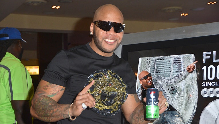 Rapper Flo Rida holds a can of Celsius Heat fitness drink during his memorabilia case dedication at the Hard Rock Hotel & Casino on June 29, 2018 in Las Vegas, Nevada.