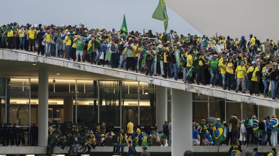 Supporters of former Brazilian President Jair Bolsonaro storm governmental buildings