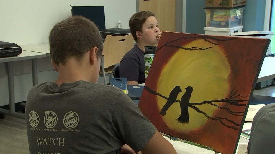 Children in the Prodigy Cultural Arts Program learn to paint. 