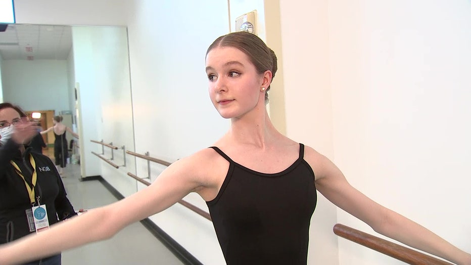 Young ballerina practices before a competition. 