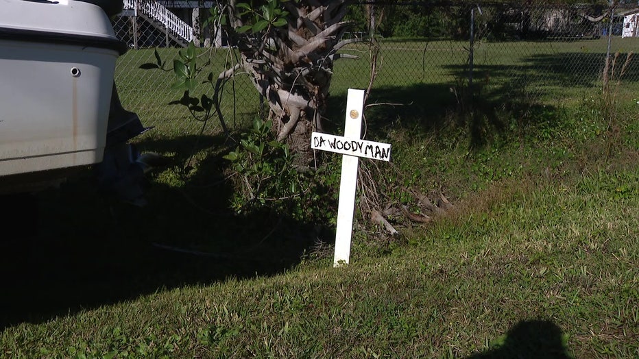 A makeshift memorial for Antonio Woods sits at the site of the fatal crash. 