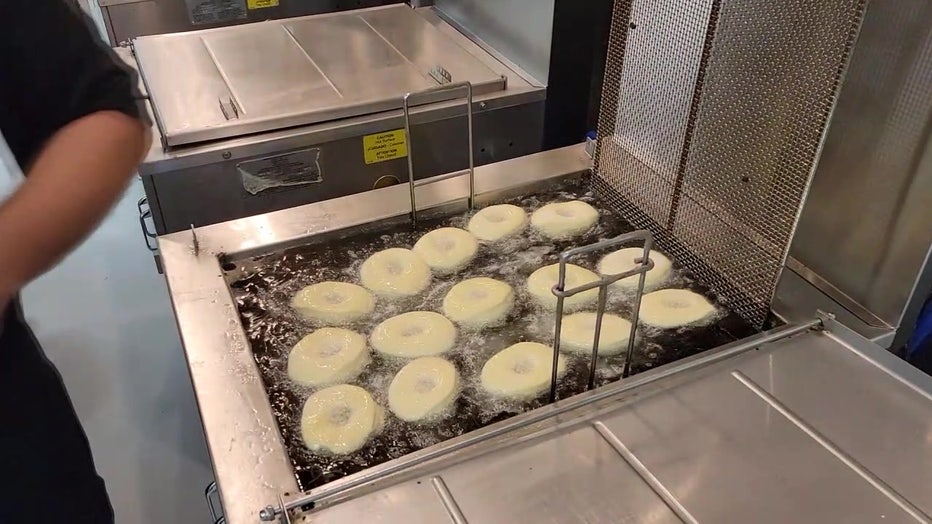 Donuts being fried at Five-O Donut Company.