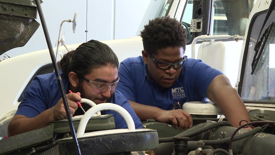 Students at Manatee Technical College help repair vehicles used in Hurricane Ian flood waters. 