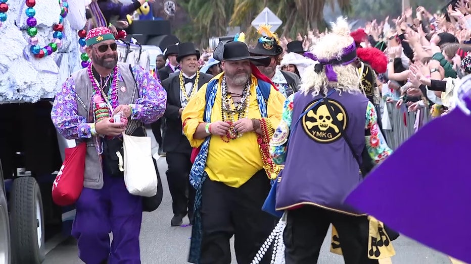 Pirates hand out beads along the Gasparilla 2023 parade route. 