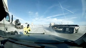 Tractor-trailer narrowly misses Wyoming state trooper on icy roadway