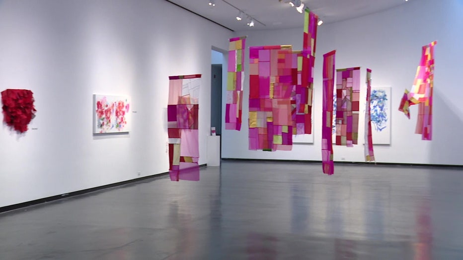The exhibit is full of vibrant colors and designs both in paintings and in hand sewn textiles.