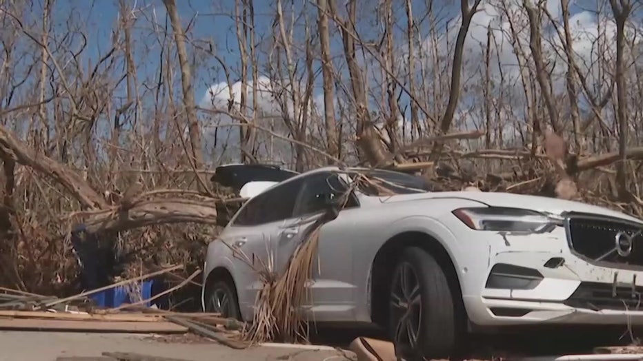 A car damaged by Hurricane Ian. 