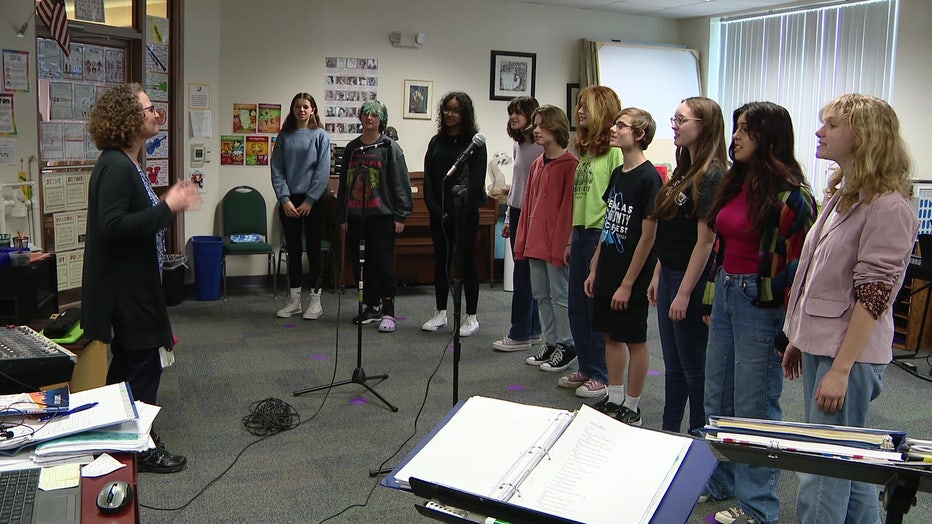 Students at Academie da Vinci Charter School for the Arts and Technology take part in a singing class.