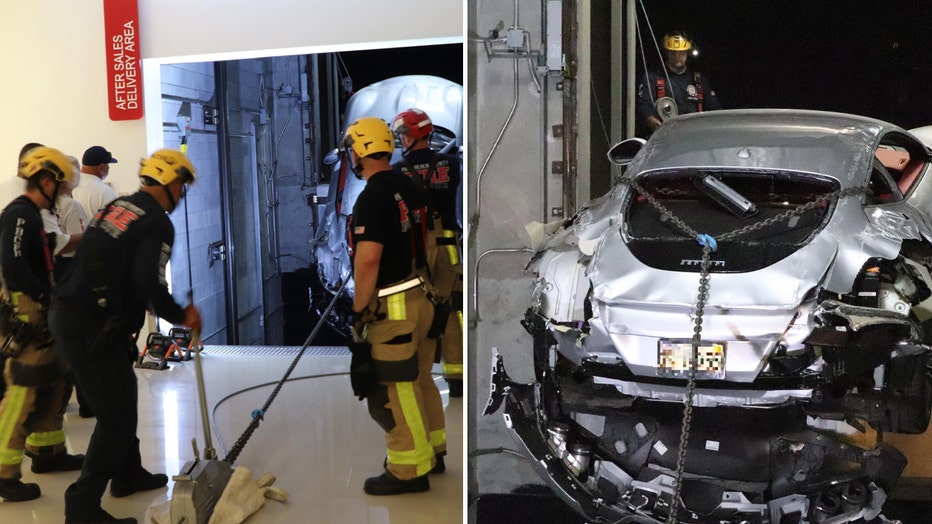 Fire rescue and towing crews work to remove a Ferrari from a dealership's car elevator shaft after it malfunctioned.
