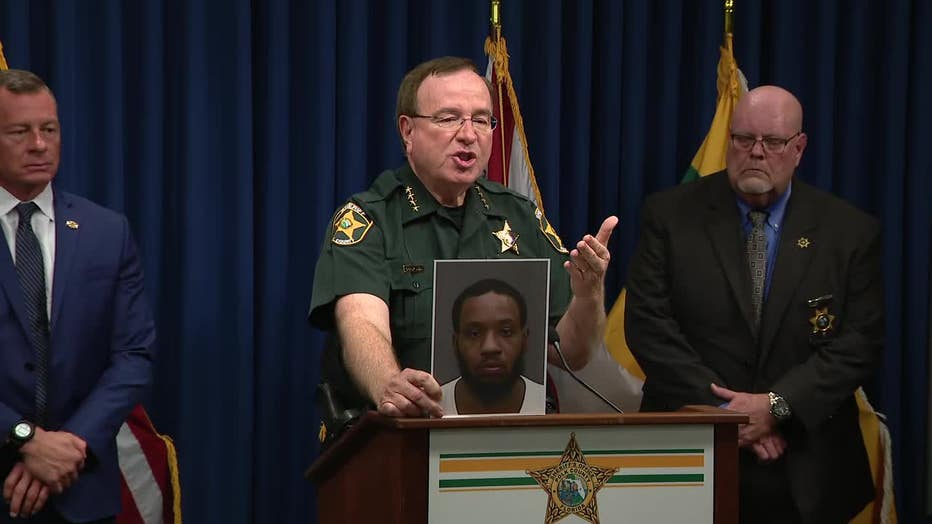 Grady Judd shows photo of suspect Derek Bacote