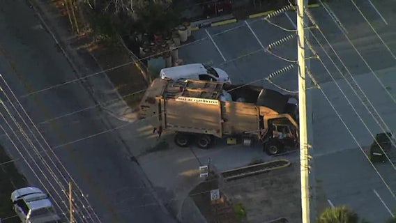 Sanitation worker hit by vehicle while helping garbage truck reverse on Clearwater road, police say