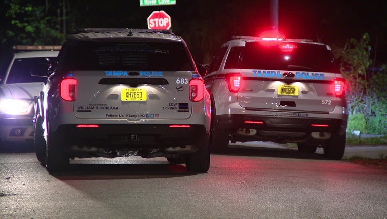 Police cars outside scene where man was shot late Wednesday night.