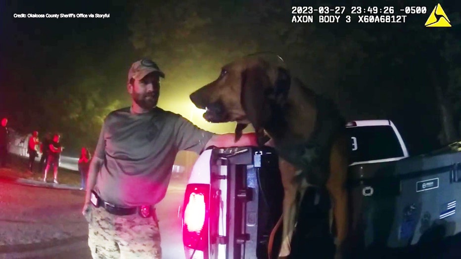 K9 Beau enjoys a drink of water after finding a missing non-verbal autistic child who wandered away from home.