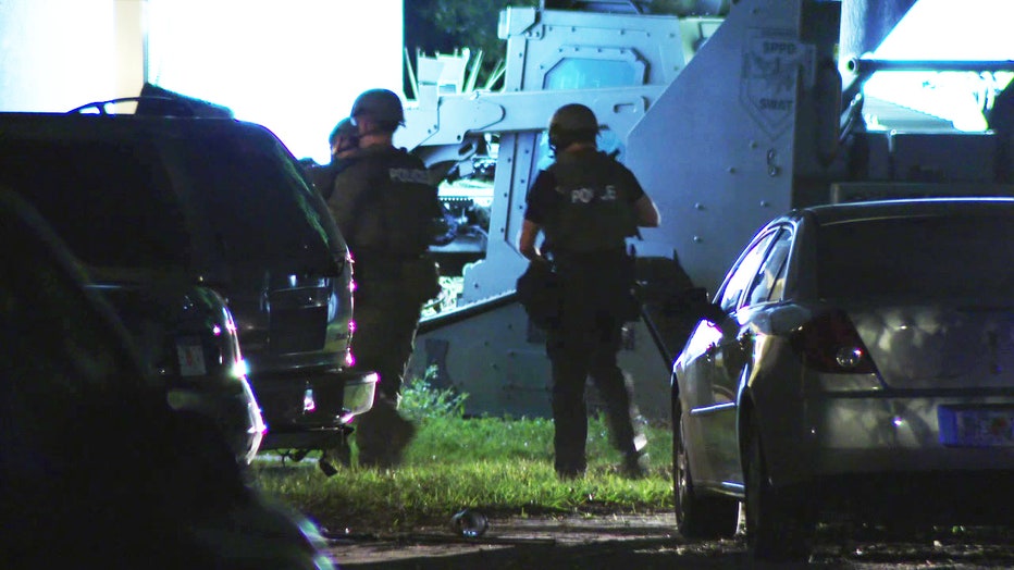 Police outside boarding home during armed standoff early Thursday morning.