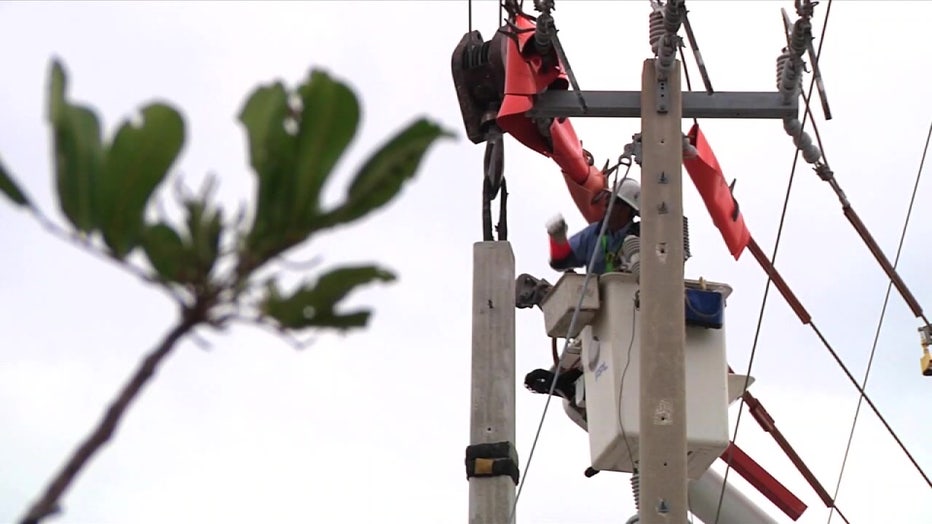 Crew member working on a power line. 