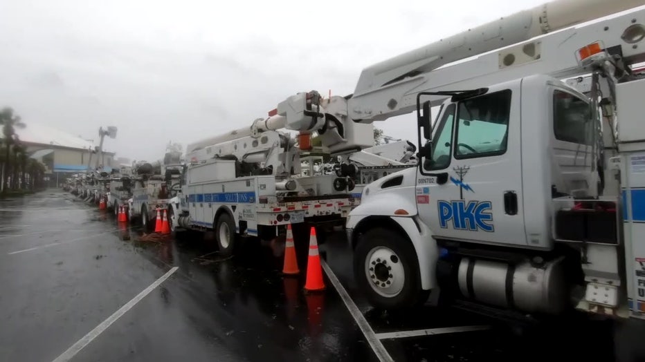 Power trucks line up ahead of a storm. 