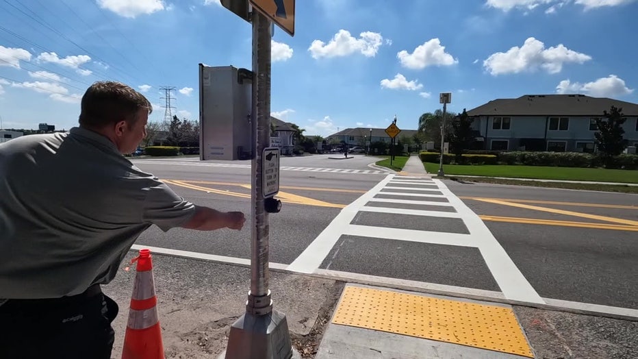 A crosswalk with lights is now up near where a teenager was killed walking to the school bus stop.