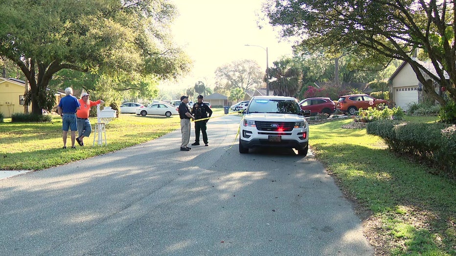 Deputies outside Land O'Lakes home where three people were shot. 