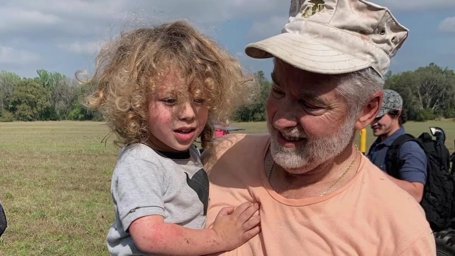 Roy Link and JJ Rowland shortly after he found the missing toddler in the woods. 