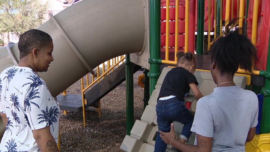 Broome family plays on the playground.