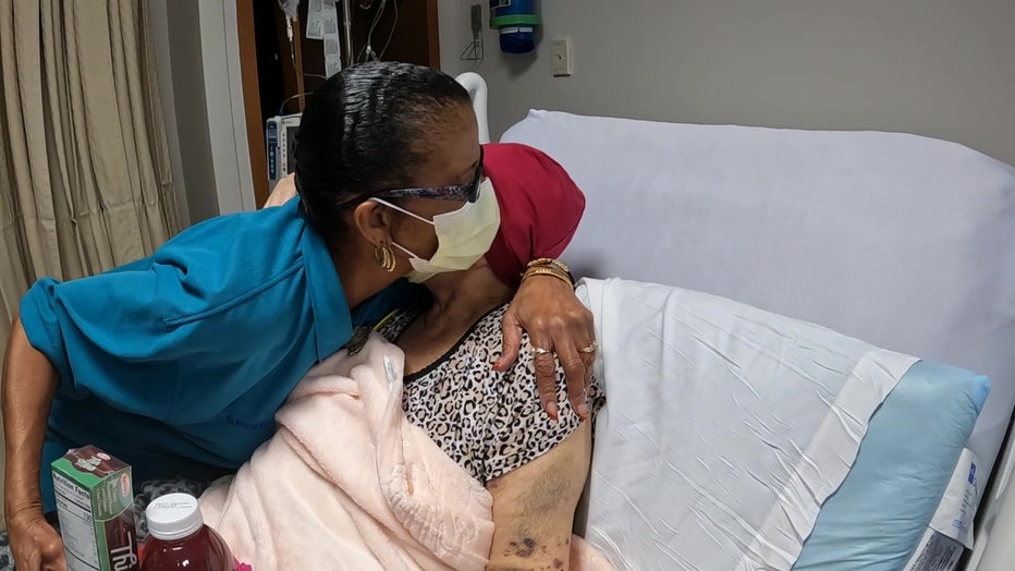 Miss Bettie hugs a patient at TGH.