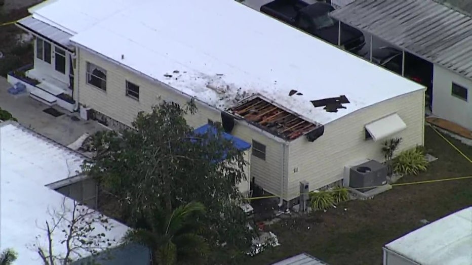 Embers from the clubhouse fire sparked a blaze at a nearby manufactured home.