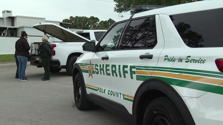 Polk deputy vehicles at scene of missing boaters search.