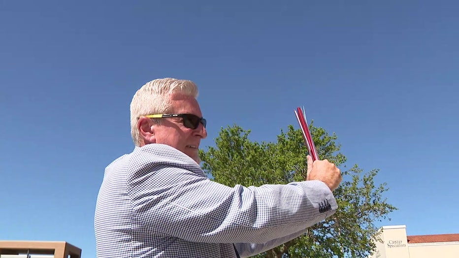 Tom Edwards shields his face from the sun. 