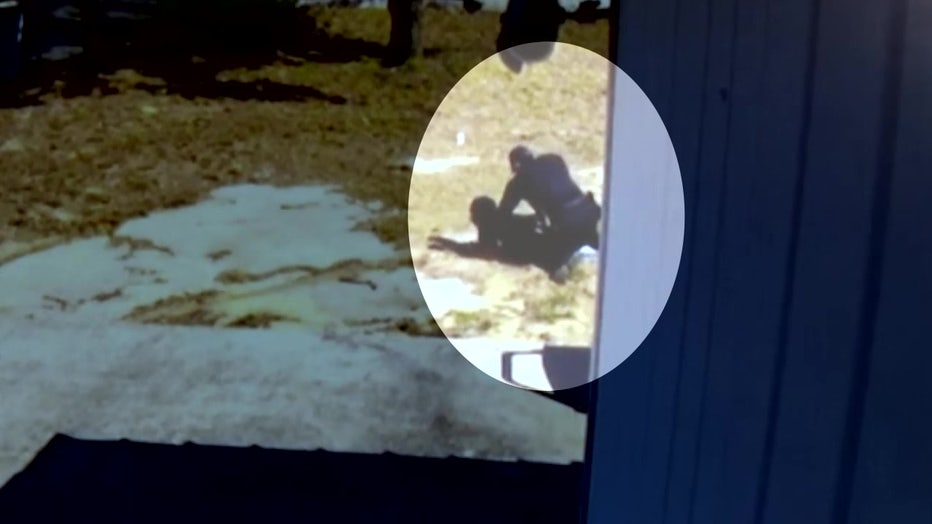 Video shows the officer punching an armed suspect during an arrest.