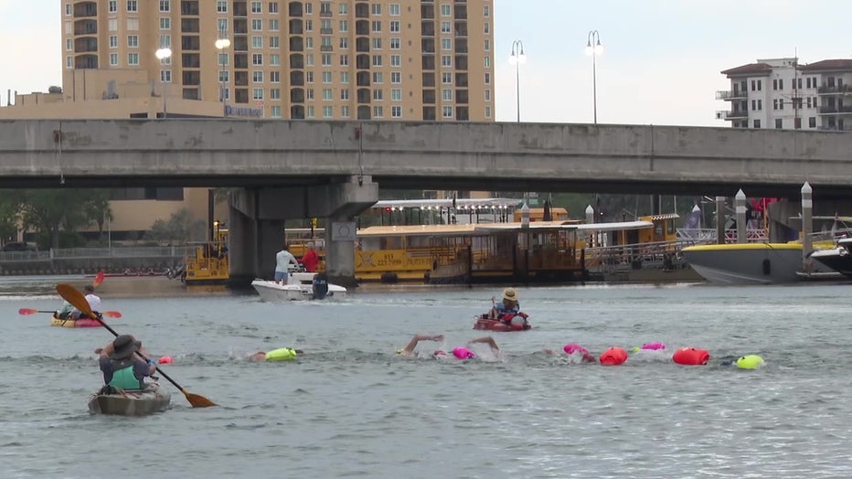 Each swimmer had a kayaker associated with them for safety reasons. 