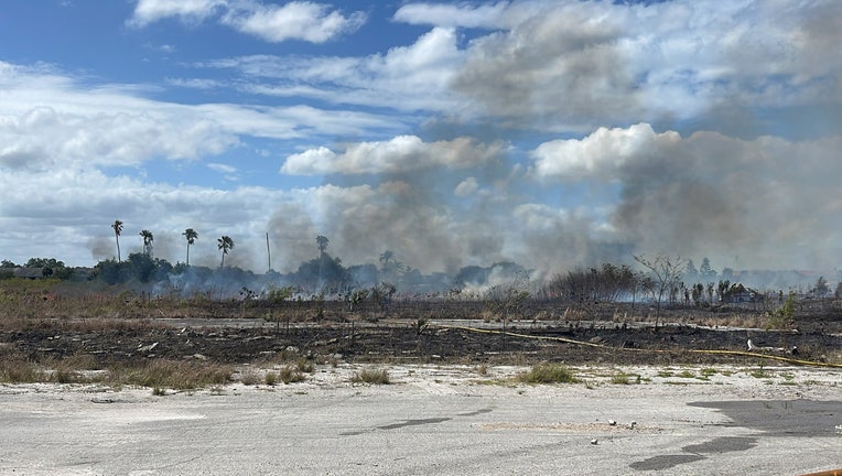 A brush fire burns on South Westshore Blvd. Image is courtesy of Tampa Fire Rescue. 