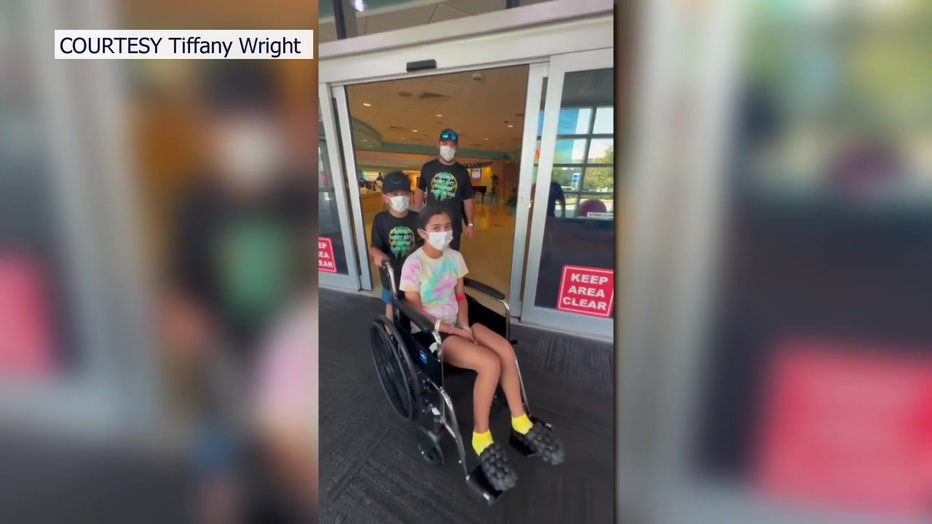 Natalie Warner leaving the hospital after a month.