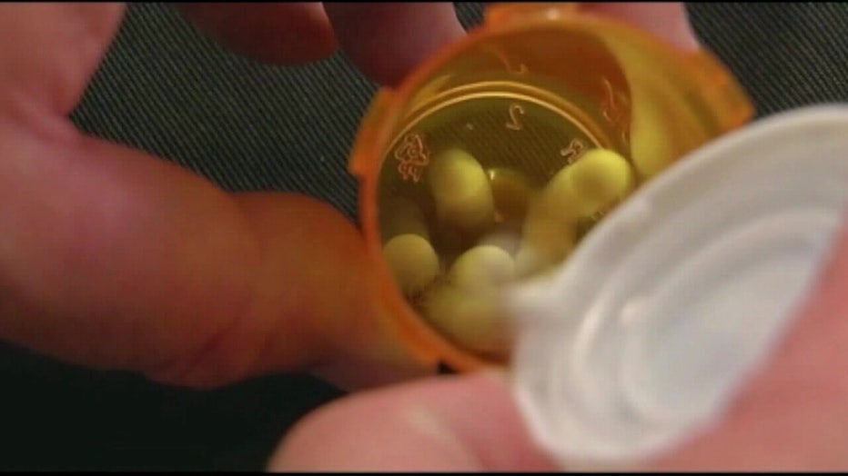 File image of prescription pills and bottle. 