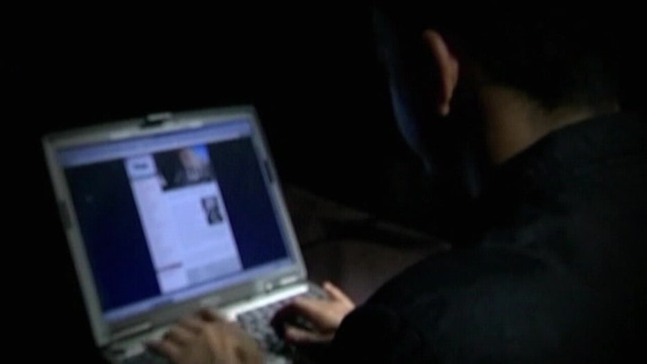 File: Person at a computer.