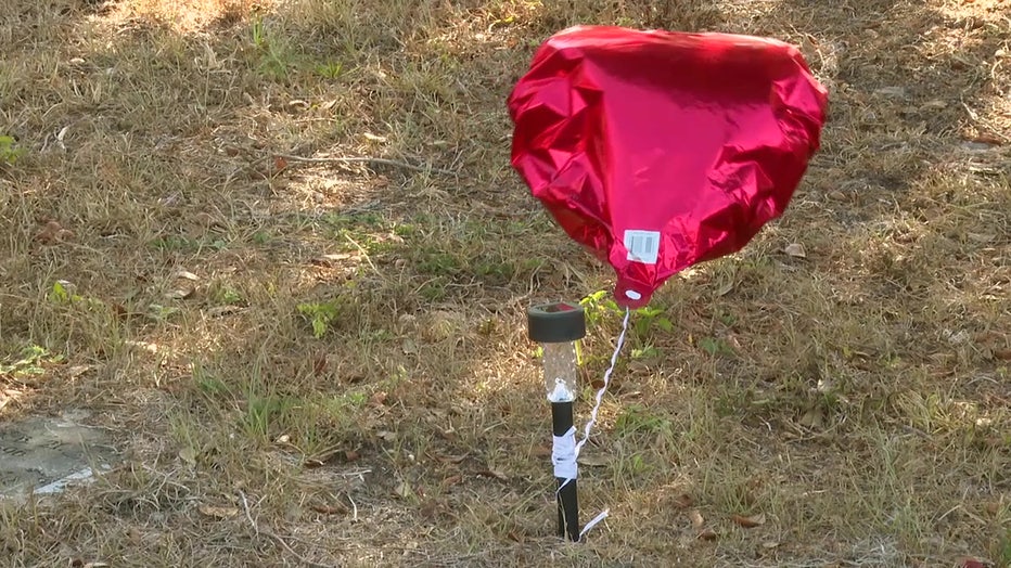 A heart-shaped balloon at Memorial Park Cemetery.