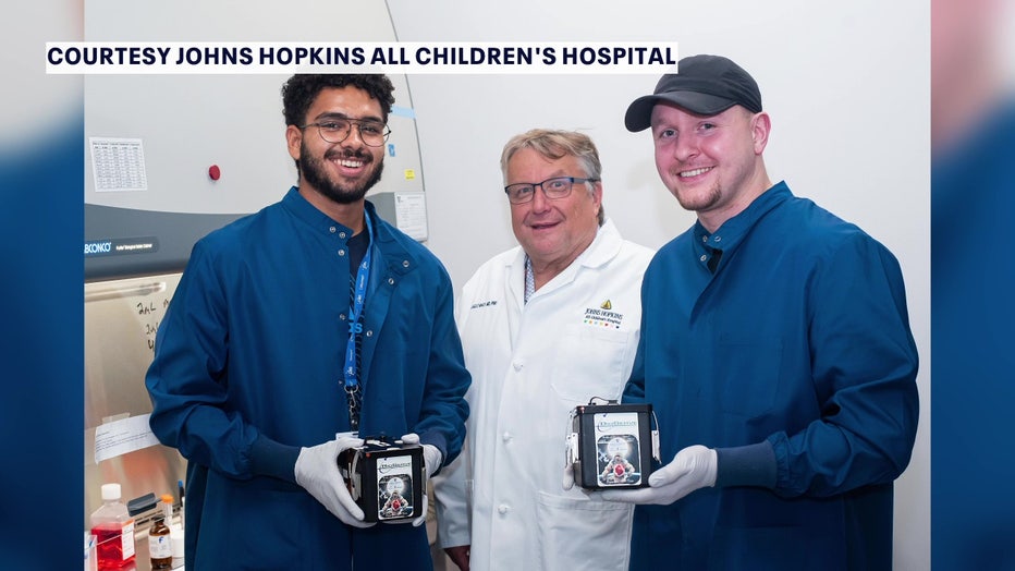 Researchers with heart tissue that went into space courtesy of John's Hopkins All Children's Hospital. 