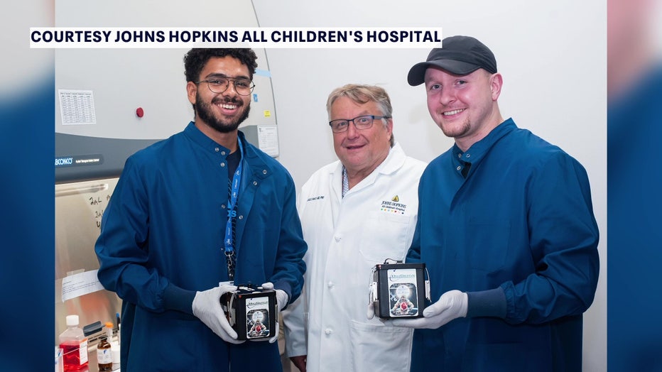 Researchers with heart tissue that went into space courtesy of John's Hopkins All Children's Hospital.