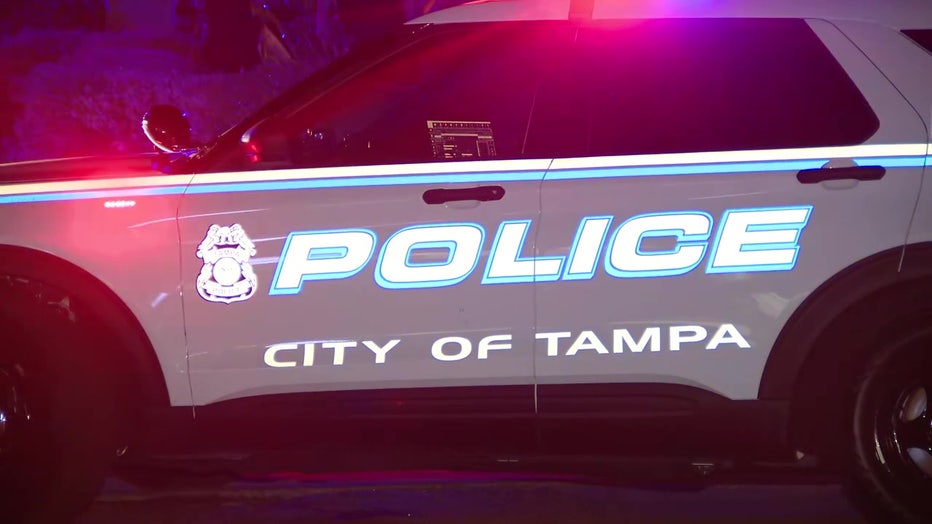 Tampa police vehicle outside apartment where Door Dash driver was forced to drive to and attacked.