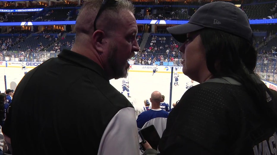 David Clegg shares a bonding moment with his family at a Lightning game.