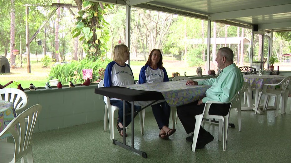 Bill and Debbie Ismer sit with Pam, who donated her kidney to Debbie. 