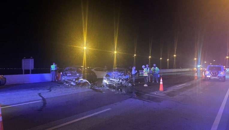 Investigators alongside vehicles involved in a 10-car pile-up on the Howard Frankland Bridge. Image is courtesy of the Florida Highway Patrol. 