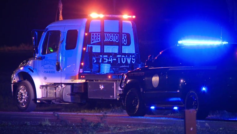 FHP patrol car lights and tow truck at scene of fatal Plant City crash. 