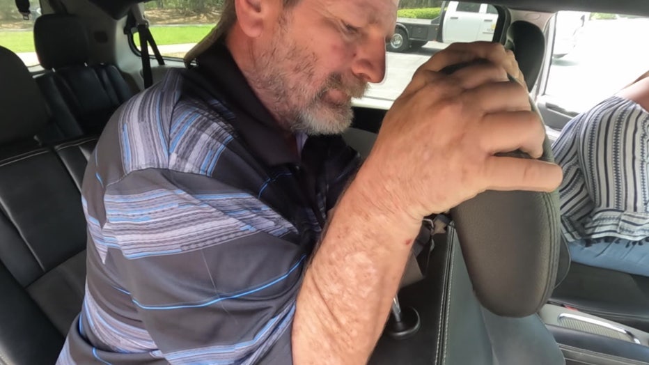 File: Husband tries to fix defective headrest