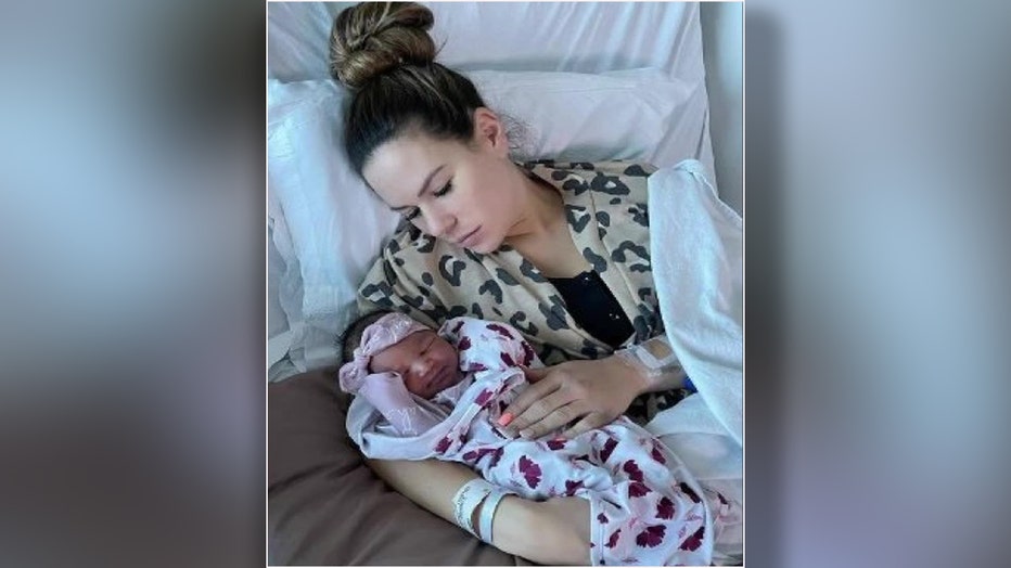 Shaquil Barrett's daughter as a baby with her mother. Image is courtesy of Jordand Barrett. 