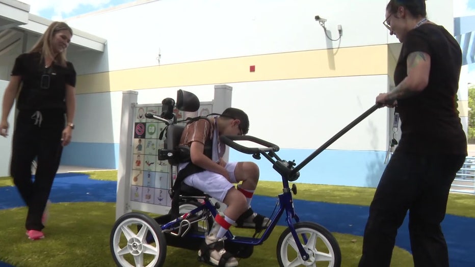 A special bike on the playground helps children be more independent. 